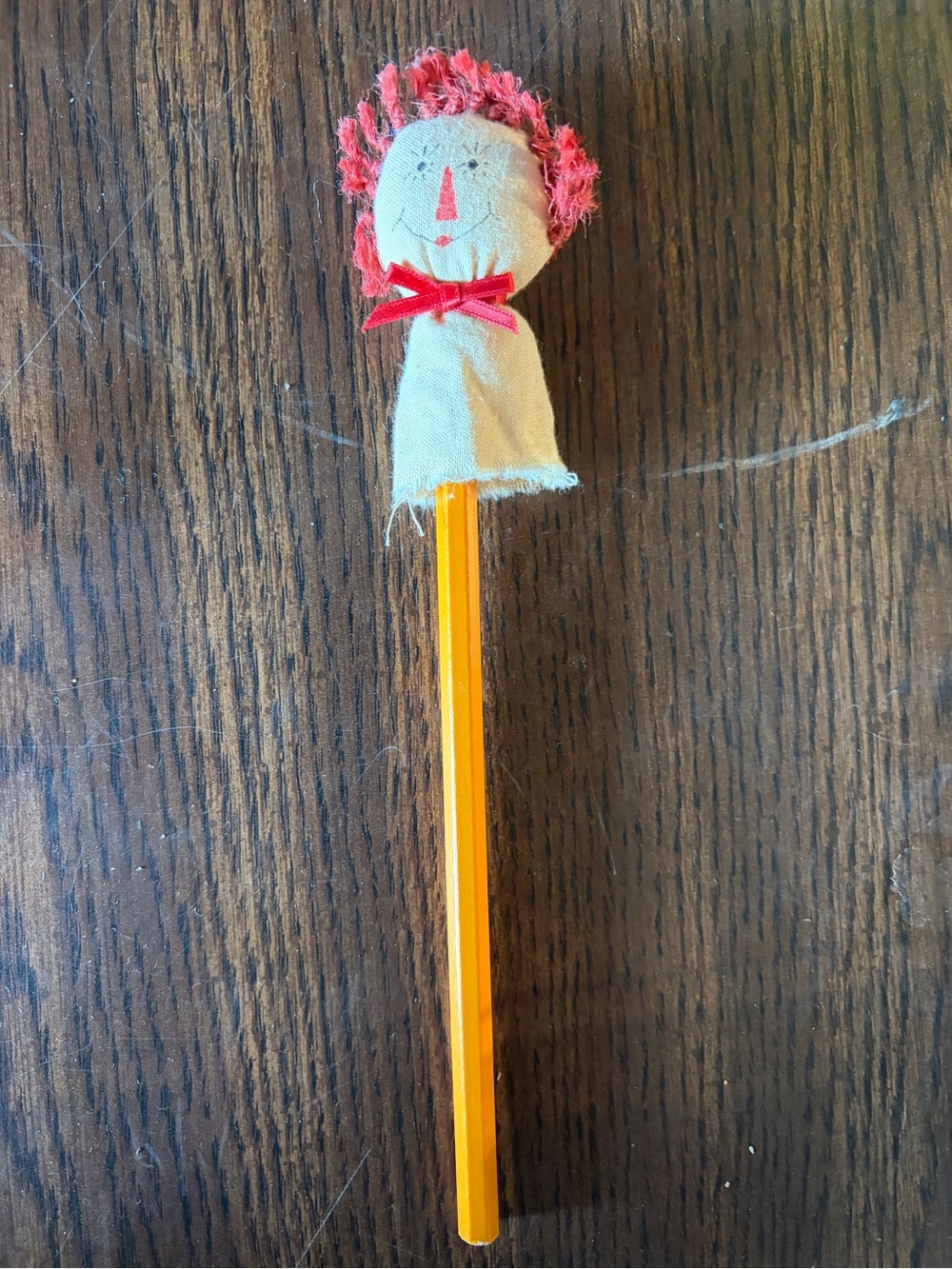 Handcrafted Red-Head Pencil Topper on Yellow Pencil